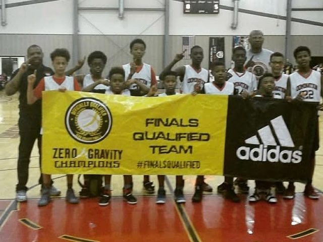 Domination team holding a Finals Qualified Team banner