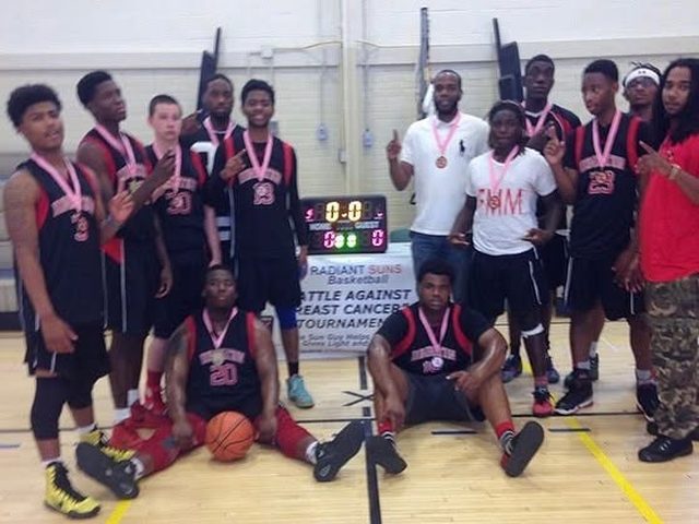 Domination players with medals beside a scoreboard